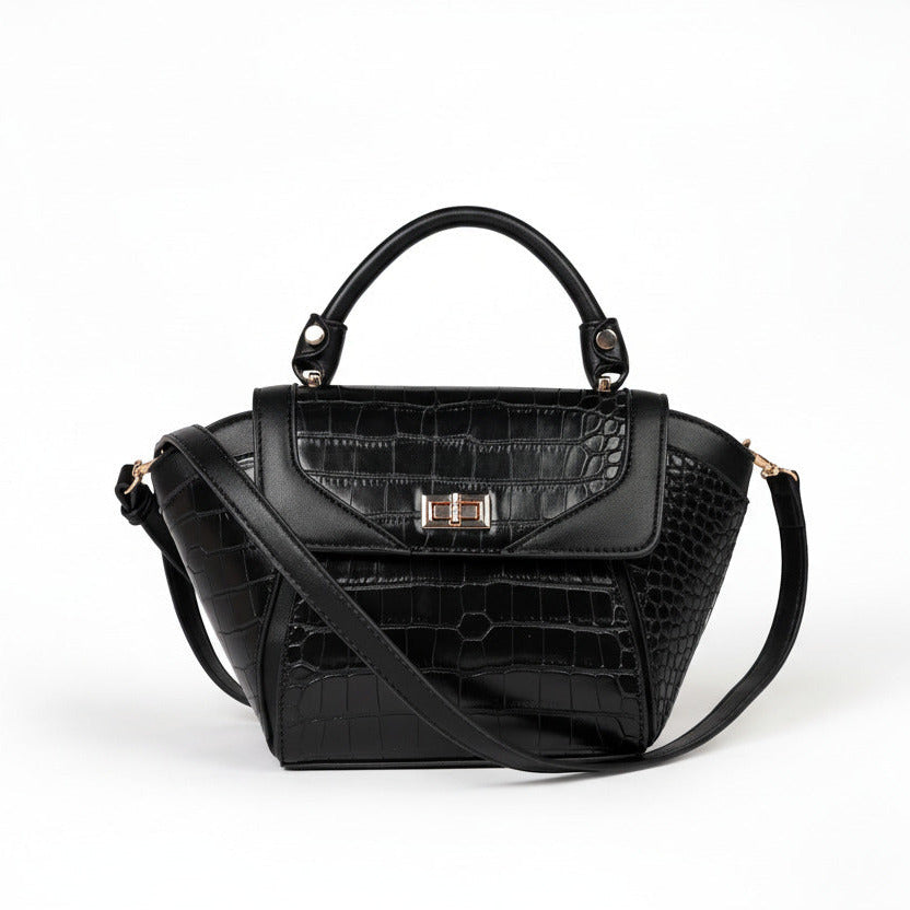 Black handbag with crocodile texture on a white background