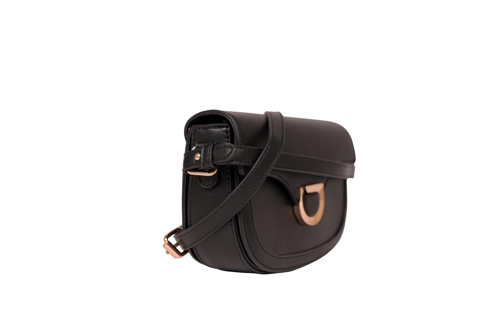 Karryol Bella black leather crossbody bag with gold-tone hardware and adjustable strap.