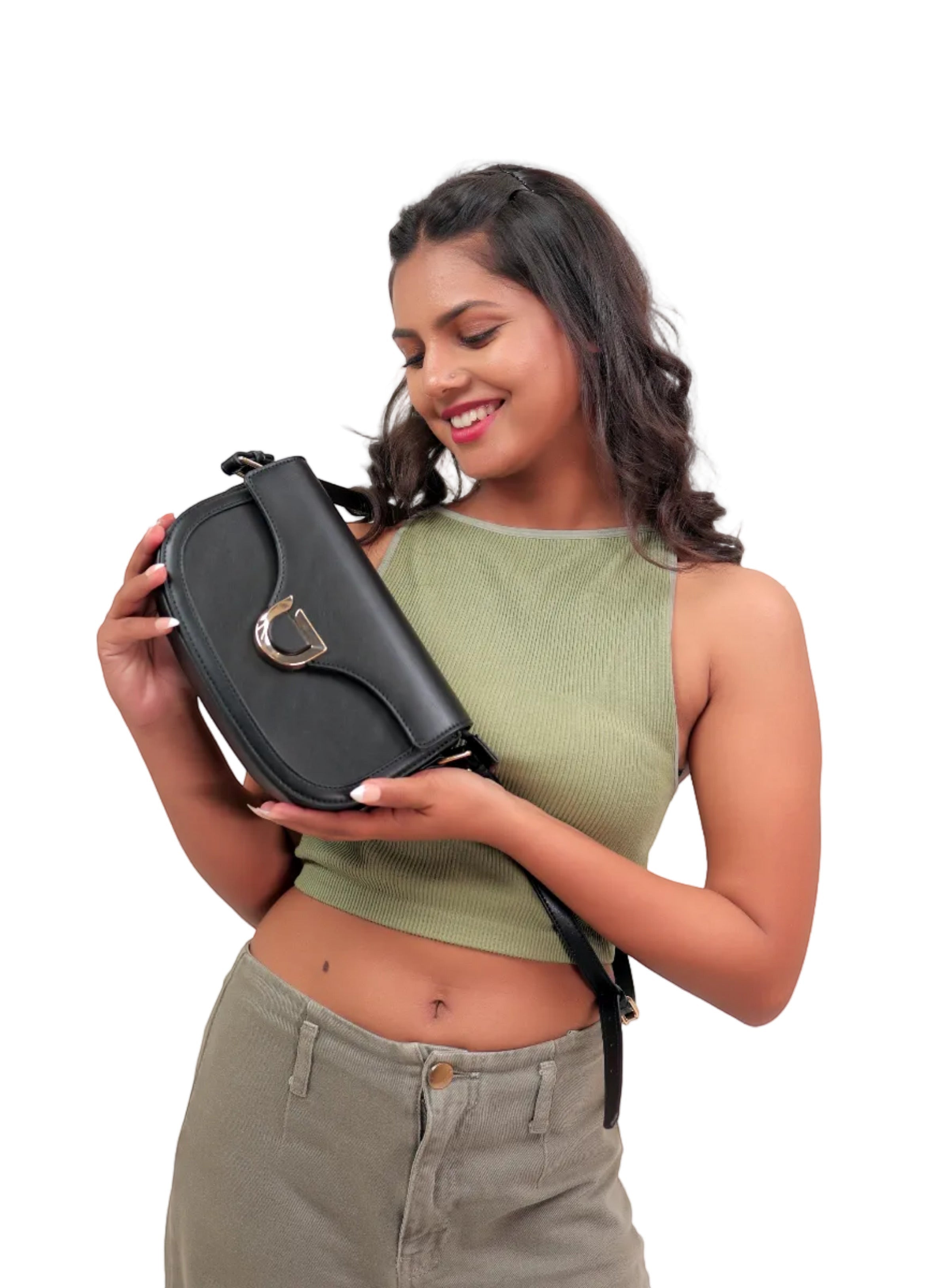 Karryol Bella black leather crossbody bag with gold-tone hardware and adjustable strap, held by a smiling woman.