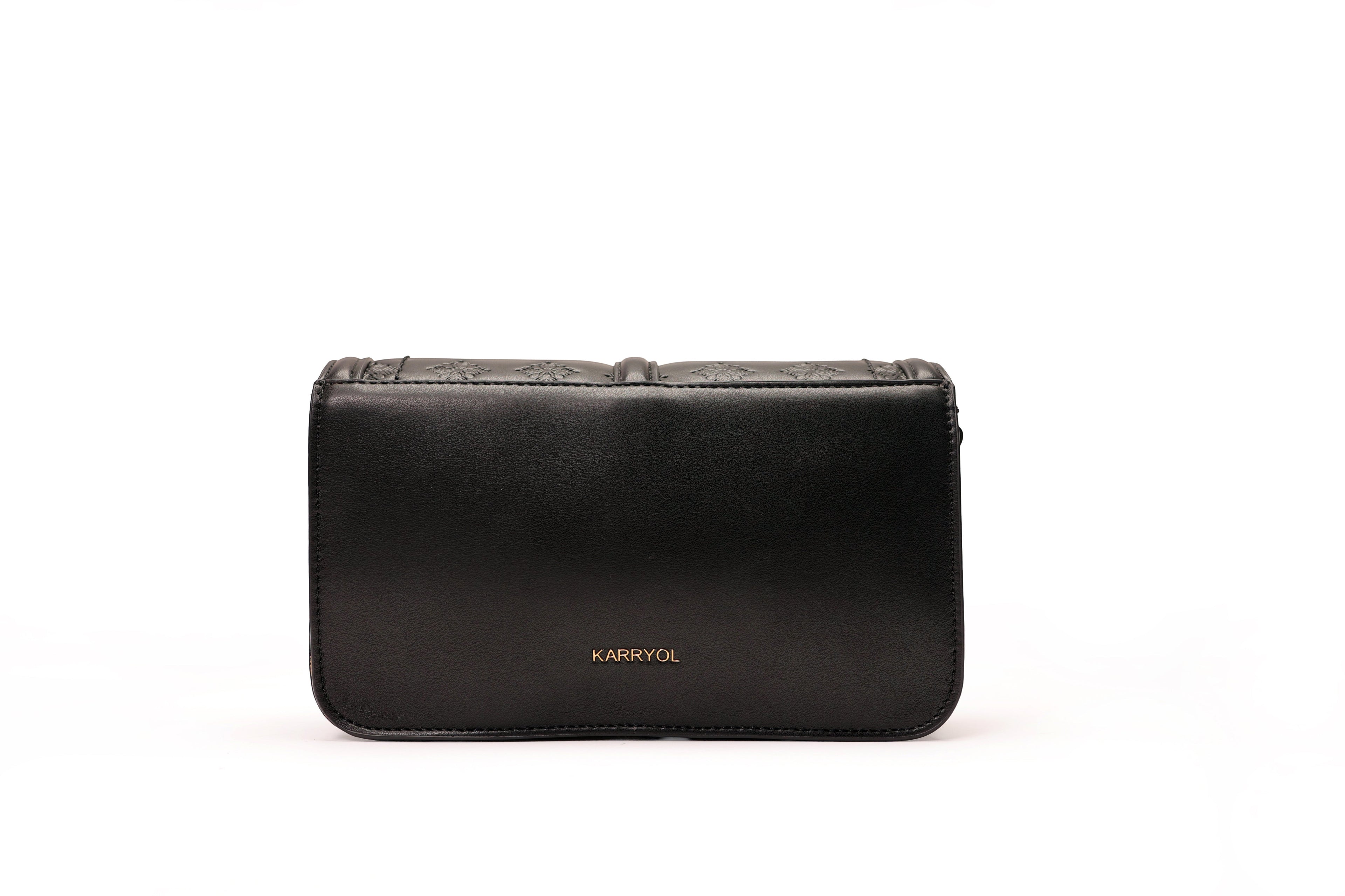 KARRYOL black faux leather crossbody bag with embossed monogram panel and gold-tone hardware. Structured design with adjustable strap.