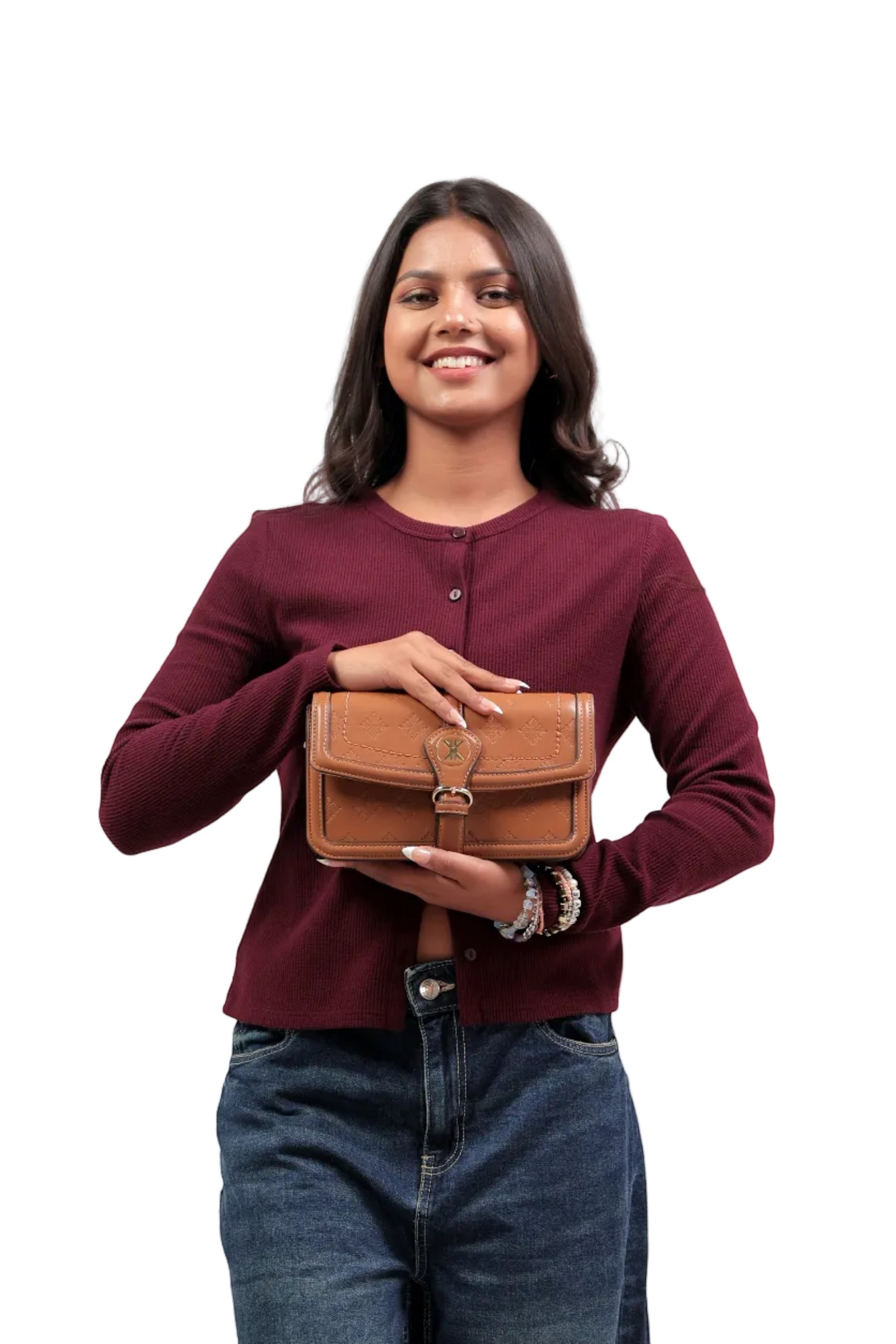 KARRYOL tan leather crossbody bag with embossed monogram panel and gold-tone buckle detail.