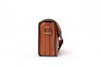 KARRYOL tan leather Kari crossbody bag with gold-tone hardware and embossed monogram panel.