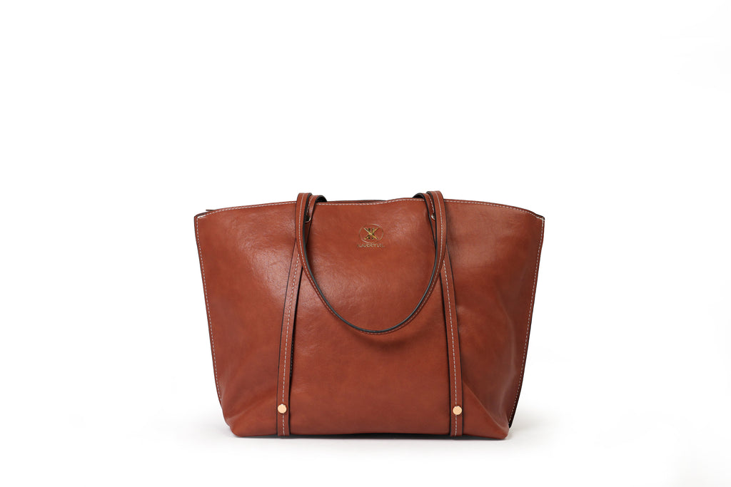 KARRYOL tan leather Monica tote bag with dual top handles, zipper closure, and embossed logo.