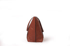 KARRYOL Monica tan leather tote bag with dual top handles and zipper closure, perfect for work or travel.